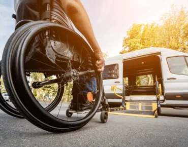 A fully equipped wheelchair-accessible NEMT van with a ramp extended at Diamond Care Transportation in South Carolina